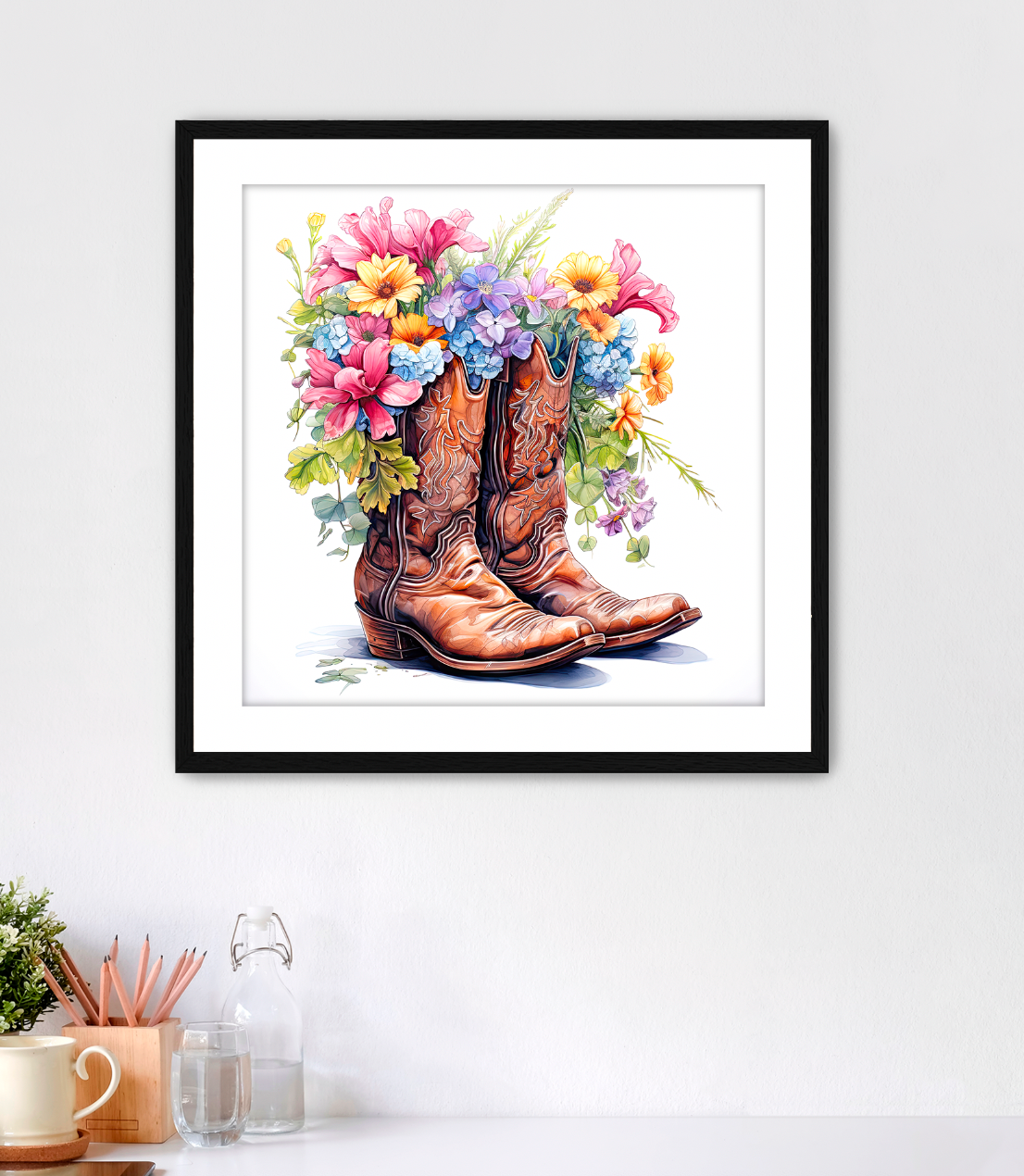 Framed Fine Artwork in highly detailed watercolor style featuring brown traditional cowboy boots with a bouquet of flowers spilling out of the top of them. This piece is a must have for western enthusiast cowgirls who are tough but have that feminine side too. This art comes with white mat and black frame. Art for sale at customconcepts.art