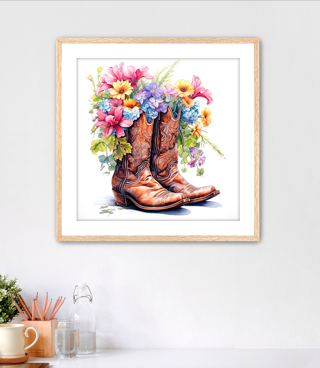 Framed Fine Artwork in highly detailed watercolor style featuring brown traditional cowboy boots with a bouquet of flowers spilling out of the top of them. This piece is a must have for western enthusiast cowgirls who are tough but have that feminine side too. This art comes with white mat and oak frame. Art for sale at customconcepts.art